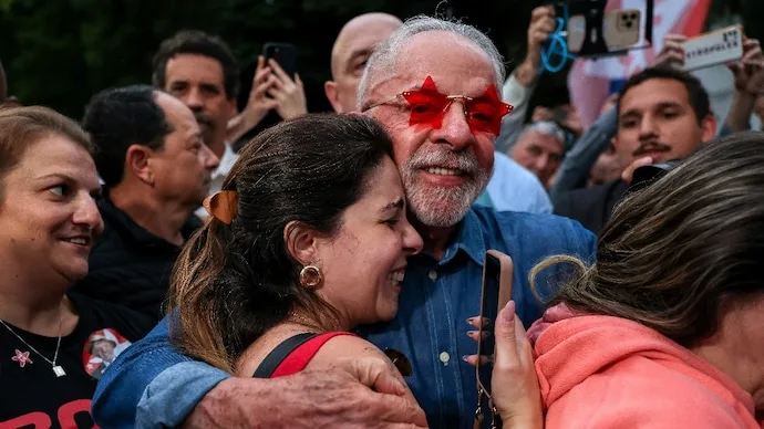Brazilian President Luiz Inacio Lula da Silva greets supporters after winning a historic fourth presidential term.