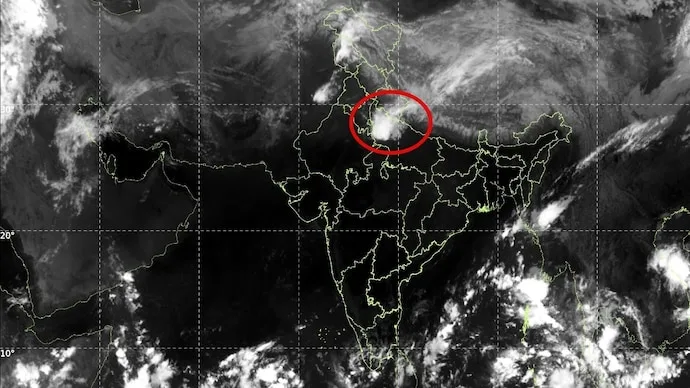 Heavy rain and dark clouds over Delhi-NCR during the October 12, 2026, weather disturbance.